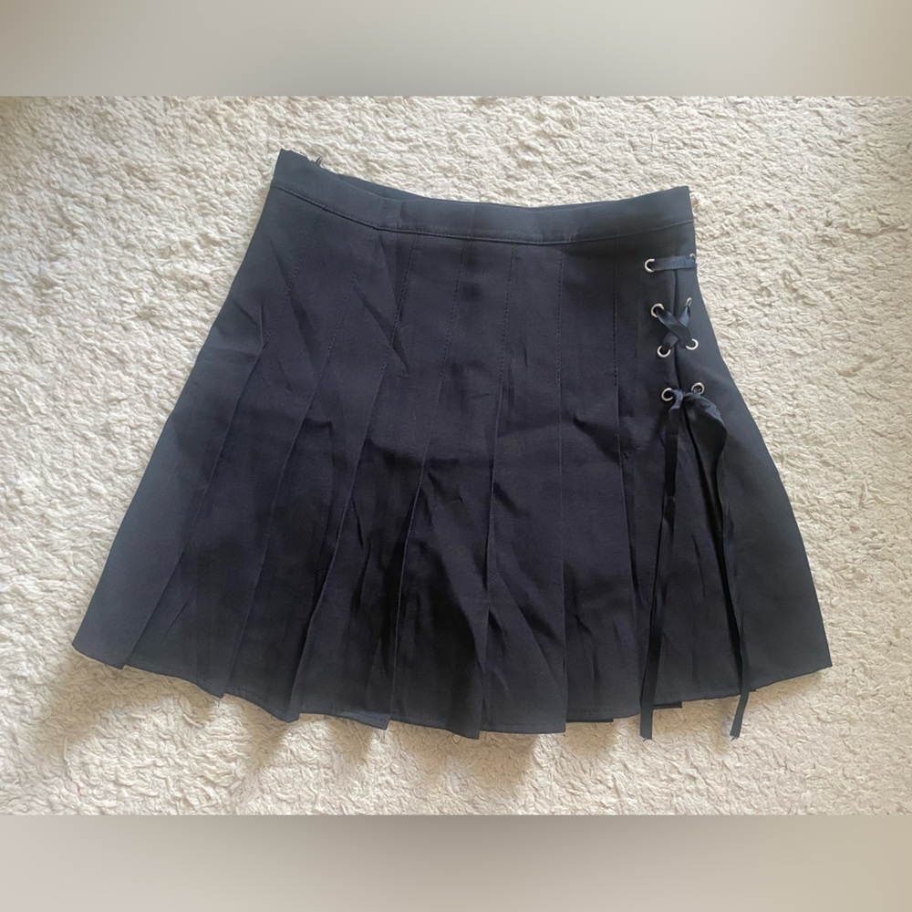 Pleated lace up mini skirt